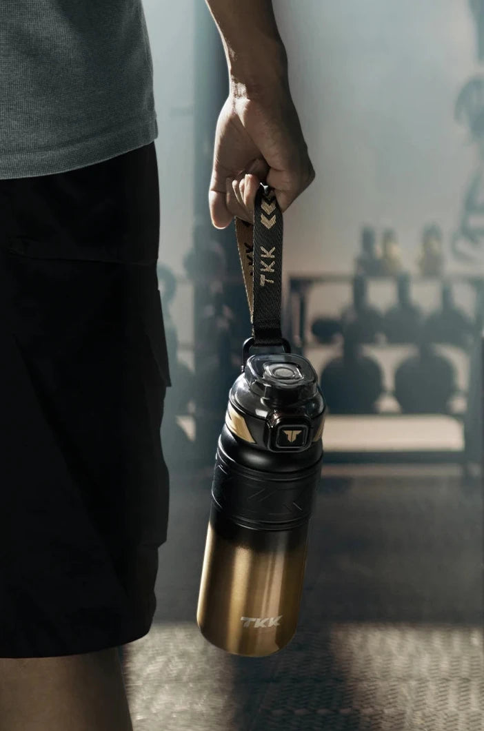 TKK Thermal Keeper Bottle in Black and Gold at the gym